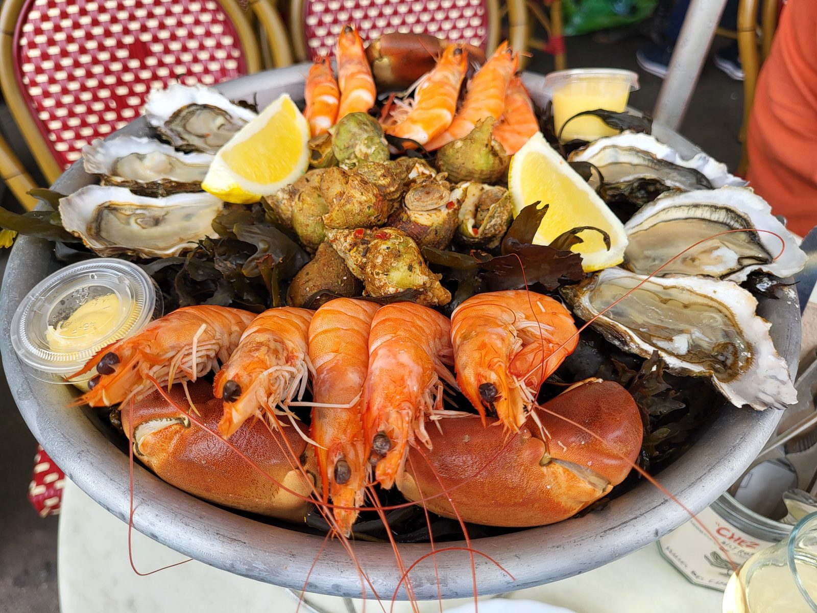 A seafood platter piled with prawns, oysters and lobster